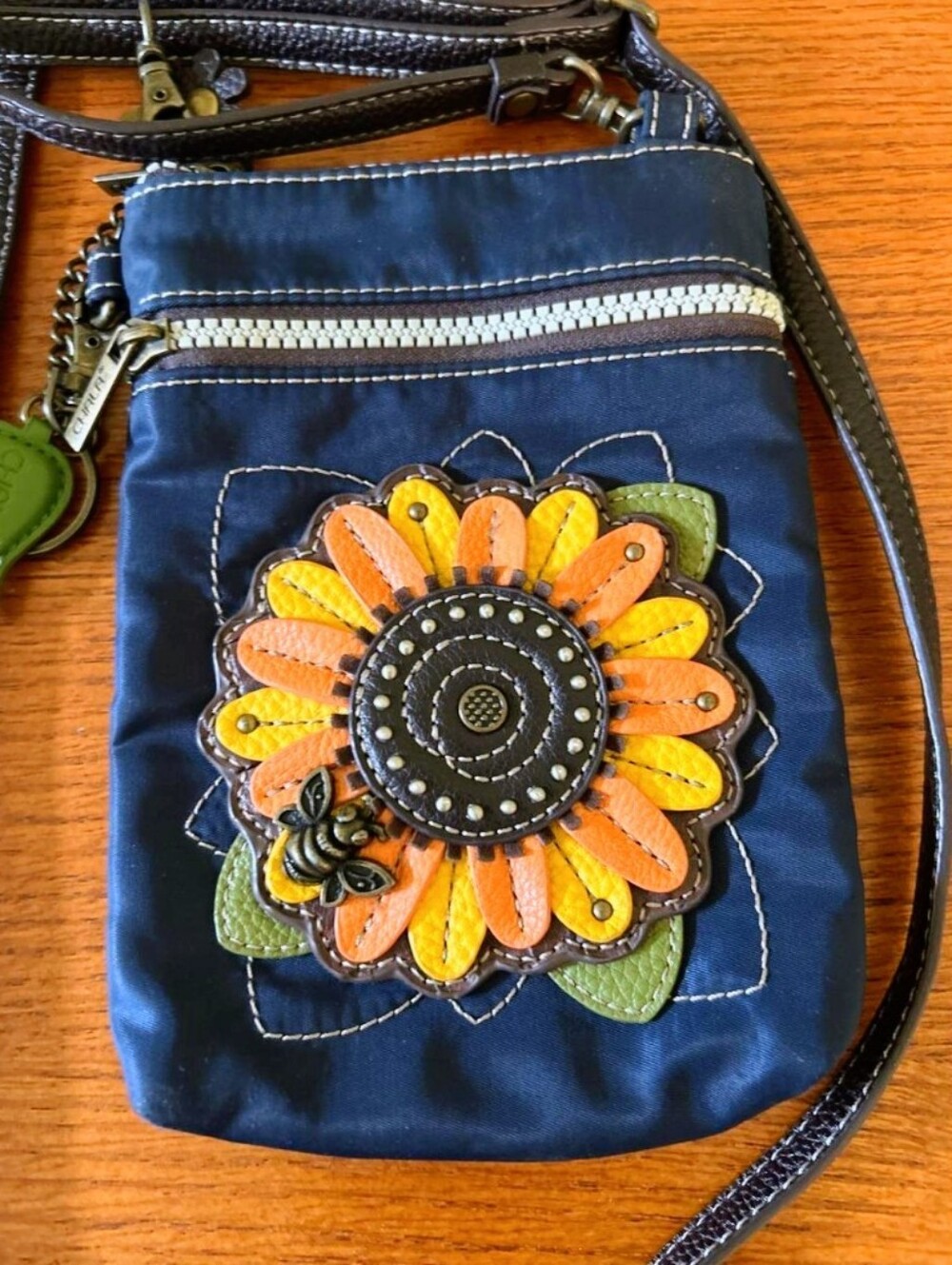 Chala Vinyl Navy Crossbody Bag with Orange & Yellow Floral Applique And Bee.